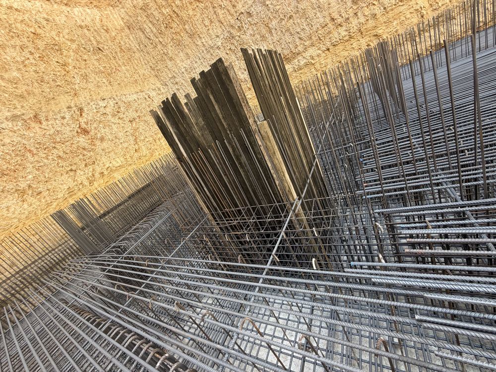 Foundation reinforcement works on site at Aya Sofia Elite — steel mesh laid inside the excavation
