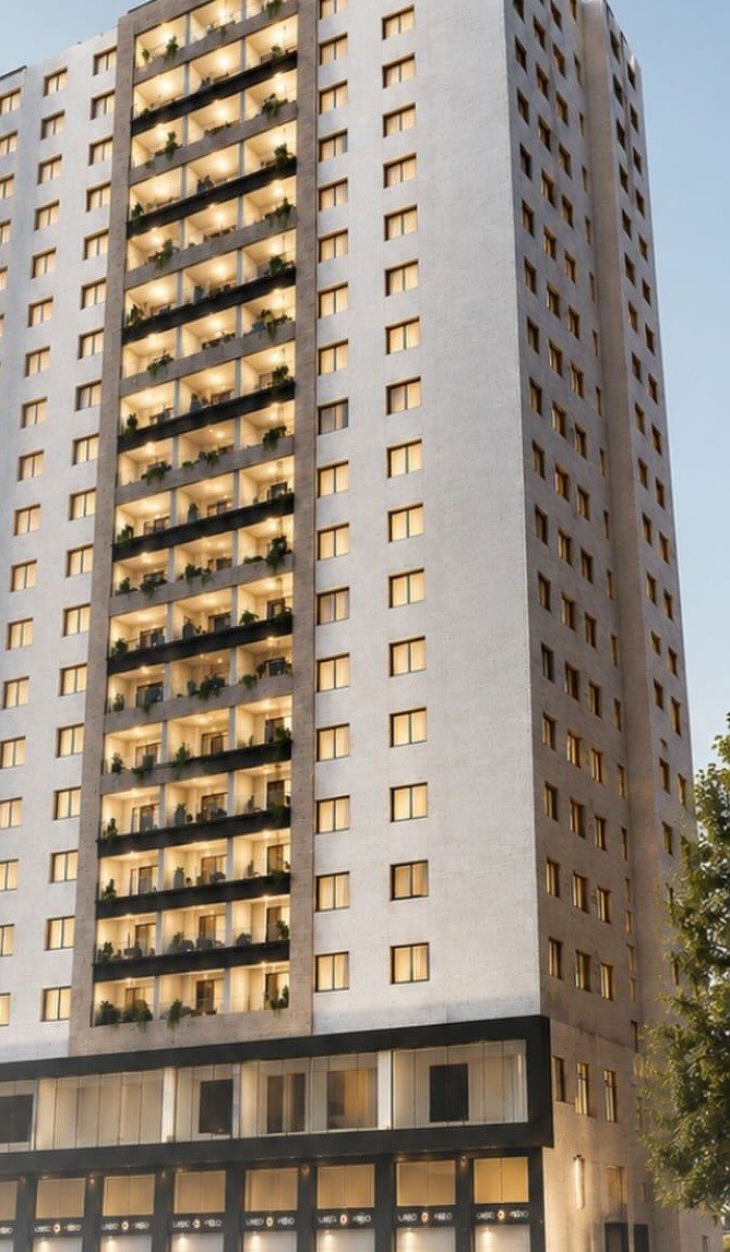 Full elevation of the Aya Sofia Elite tower — apartments above a commercial ground floor
